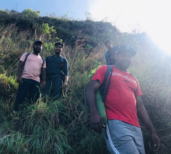 Hikers trekking down the Yahangala trail after summiting.
