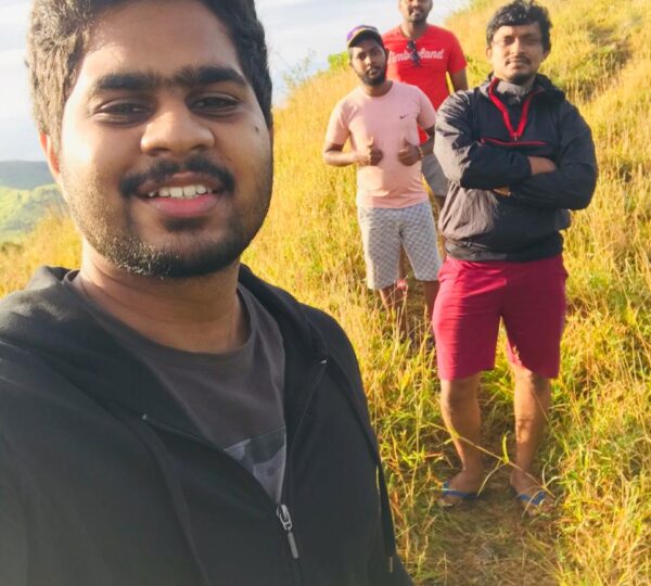 Group of hikers celebrating at the Yahangala summit.