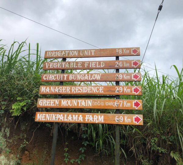 Directional signboard showing routes near Haritha Kanda Mountain
